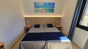 Postel nebo postele na pokoji v ubytování Marina Palmanova Apartamentos