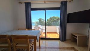 TV a/nebo společenská místnost v ubytování Marina Palmanova Apartamentos