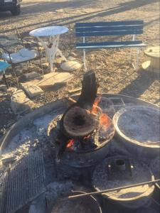 a fire pit with a grill and a table and chairs at Corella Creek Country Farm Stay in Nelia +55 photos