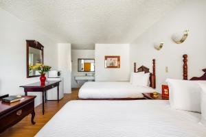 Postel nebo postele na pokoji v ubytování OYO Hotel Groesbeck