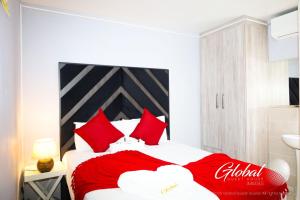 Postel nebo postele na pokoji v ubytování Global Guest House