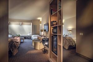 A bed or beds in a room at Brenta Dolomites