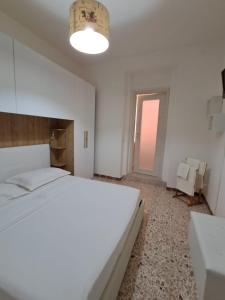 Postel nebo postele na pokoji v ubytování Camera Alghero Centro