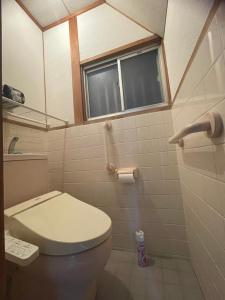 a bathroom with a toilet and a window at 福苑李 in Osaka +14 photos