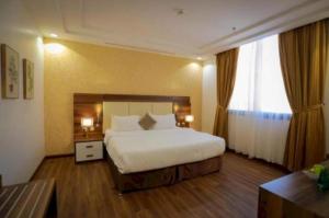 Ένα ή περισσότερα κρεβάτια σε δωμάτιο στο Palette Luxury Mirage Hotel