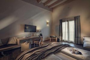 A bed or beds in a room at Brenta Dolomites