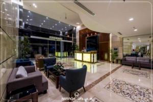 a lobby with couches and chairs in a building at PRIMOTEL Grand Al Taoubah in Jeddah