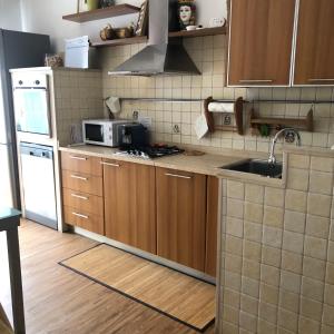 Kuchyň nebo kuchyňský kout v ubytování Casa Dorina charme e comfort a 100 m dal mare