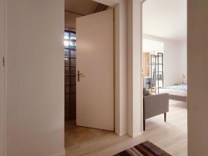 an open door to a room with a bedroom at Studio near Zurich in Affoltern