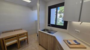 TV a/nebo společenská místnost v ubytování Marina Palmanova Apartamentos