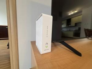 a nintendo wii game console sitting next to a tv at Apartament #RYMANOWSKA FV Parking Balkon in Rzeszów +4 photos