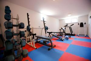 a gym with several exercise bikes in a room at Apartments Villa San Antonio in Crikvenica