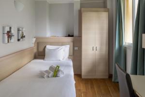 Кровать или кровати в номере B&B Hotels Park Hotel Suisse Santa Margherita Ligure