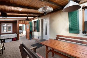 a patio with a wooden bench and a table at Ferienhaus Tanneberg in Tanneberg
