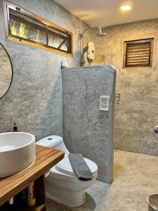 a bathroom with a toilet and a sink at PaChaSi Samui Bungalows in Ban Bang Po +58 photos
