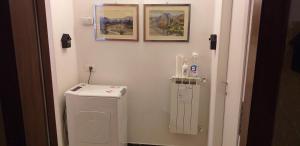 a bathroom with a washing machine in a room at Sportrek House in Levanto