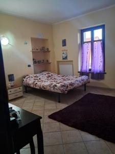 Postel nebo postele na pokoji v ubytování Cascina Argo + 29 fotografií