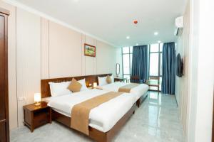 Ένα ή περισσότερα κρεβάτια σε δωμάτιο στο Lotus 68 Hotel