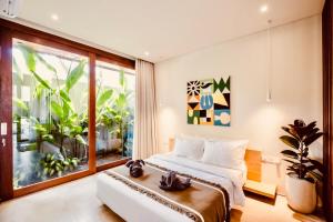 TheHub Pererenan Coworking, Pool and Rooftop客房内的一张或多张床位