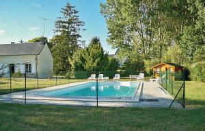 a swimming pool with a fence around it at 4 Bedroom Amazing Home In Bourgueil in Bourgueil