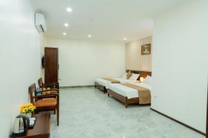 Ένα ή περισσότερα κρεβάτια σε δωμάτιο στο Lotus 68 Hotel +12 φωτογραφίες