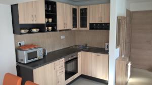 A kitchen or kitchenette at Gereben Apartman Pécs