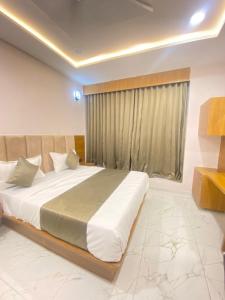 Postel nebo postele na pokoji v ubytování Hotel Elite