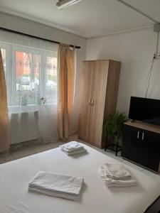 Ένα ή περισσότερα κρεβάτια σε δωμάτιο στο Apartament Octav