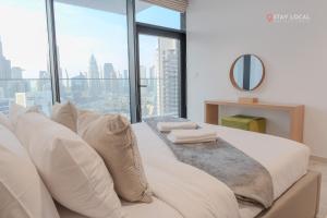 Posezení v ubytování Downtown Dreams I Cozy 2BR Getaway I Iconic Full Burj Khalifa Views I Near Dubai Mall + 25 fotografií