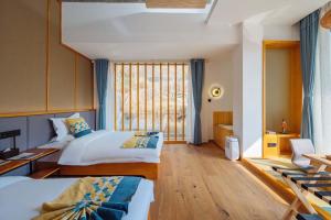 Postel nebo postele na pokoji v ubytování Yichun Jiuyu Xinzhi Light Luxury B&B
