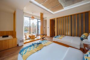 Postel nebo postele na pokoji v ubytování Yichun Jiuyu Xinzhi Light Luxury B&B
