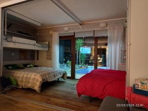 a bedroom with two beds and a large mirror at Gaia Bareyo in Bareyo +27 photos
