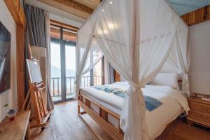 Postel nebo postele na pokoji v ubytování Yichun Jiuyu Xinzhi Light Luxury B&B