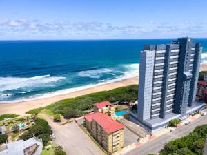 an aerial view of a hotel and the beach at Sea facing apartment 1703 on High Tide Amanzimtoti in Amanzimtoti