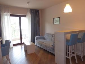 a living room with a couch and a table at Apartments Bella di Mare in Kotor