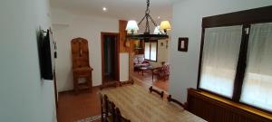 a living room with a couch and a large window at Casa La Parra en Teruel in Villastar +57 photos