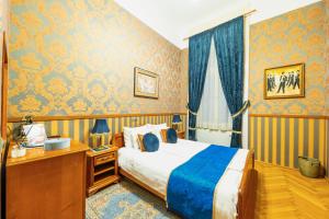 Posteľ alebo postele v izbe v ubytovaní Cotton House Hotel Budapest
