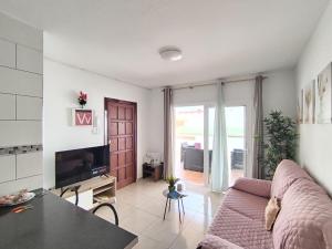 TV a/nebo společenská místnost v ubytování RenTenerife KiteSurf & Chill El Medano