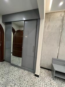 an elevator in a building with a glass door at Vorano Boutique Hotel Islamabad in Islamabad +26 photos