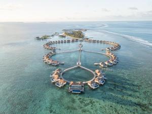 an aerial view of a resort in the ocean at Radisson Blu Resort Maldives with 50 percent off on Sea Plane round trip 03 nights & above in Fenfushi