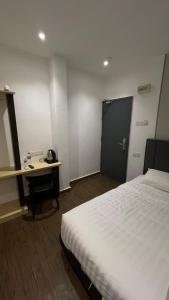 Winn's Hotel Bentong客房内的一张或多张床位