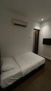 Winn's Hotel Bentong客房内的一张或多张床位