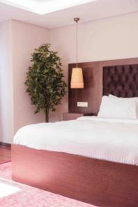 Кровать или кровати в номере Phellos Suites Boutique Hotel