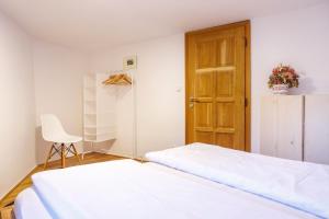 Postel nebo postele na pokoji v ubytování Apartments No.59 Loket