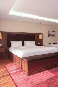 Кровать или кровати в номере Phellos Suites Boutique Hotel