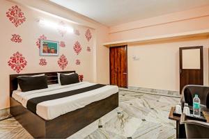 Ένα ή περισσότερα κρεβάτια σε δωμάτιο στο Hotel O Aarshi Palace