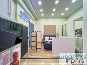 a room with a bedroom and a bed in a room at 05 - Parisian Design Loft in Paris