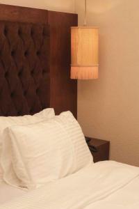 Кровать или кровати в номере Phellos Suites Boutique Hotel