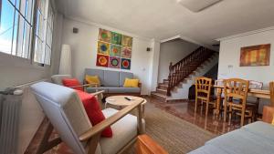 a living room with a couch and a table at Casa Frijol 20metres from the beach in Los Alcázares
