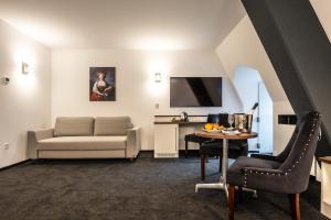 TV a/nebo společenská místnost v ubytování Schlosshotel Weilburg